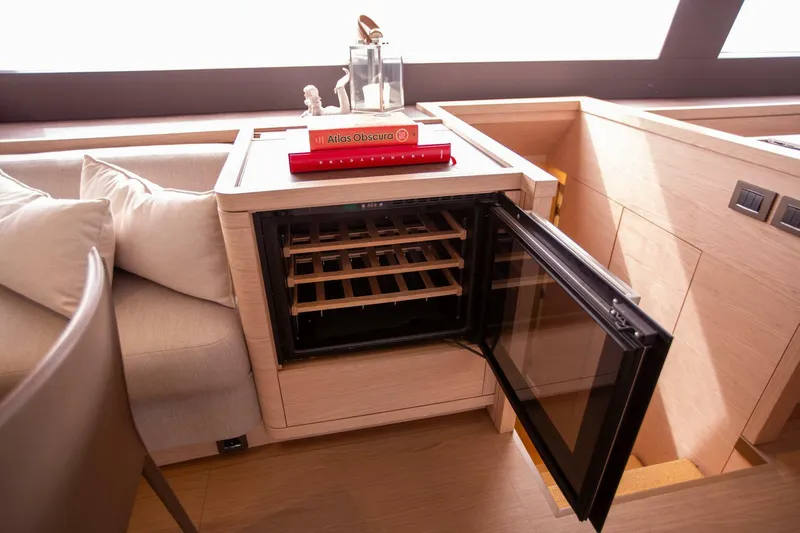 Sicilian Breeze Yacht Photos Pics Luxurious interior of 2021 Lagoon Seventy 7 yacht with open wine cooler.