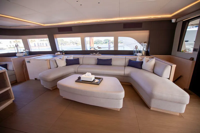 Sicilian Breeze Yacht Photos Pics Luxurious interior of 2021 Lagoon Seventy 7 yacht with elegant seating and modern design.