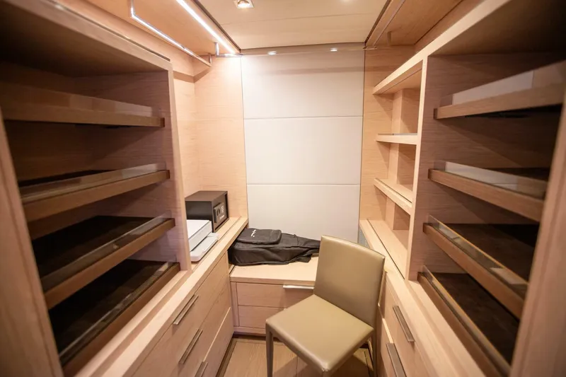 Sicilian Breeze Yacht Photos Pics Luxurious wooden closet interior on a 2021 Lagoon Seventy 7 yacht.