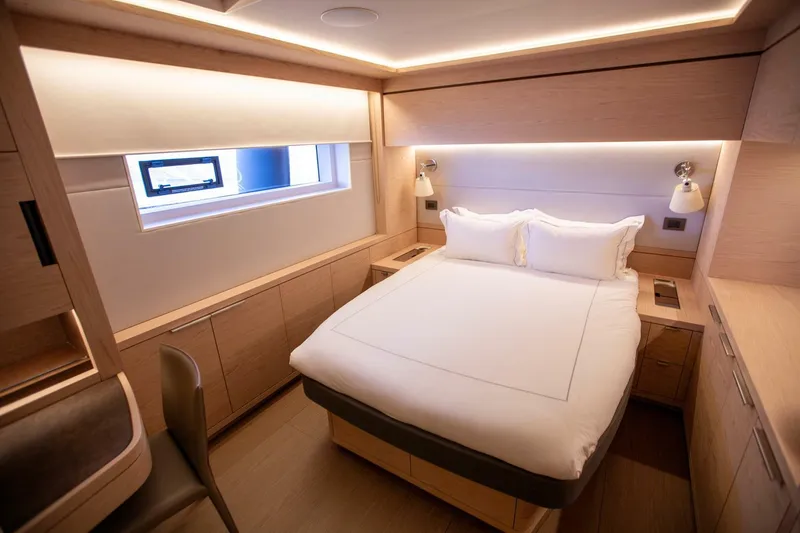 Sicilian Breeze Yacht Photos Pics Luxurious cabin interior of 2021 Lagoon Seventy 7 yacht with modern design and cozy bed.