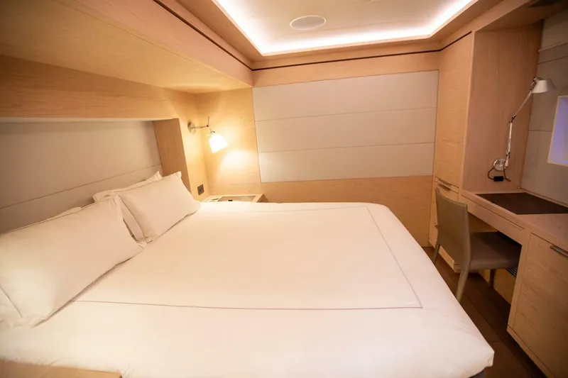 Sicilian Breeze Yacht Photos Pics Luxurious cabin interior of 2021 Lagoon Seventy 7 yacht with modern furnishings.