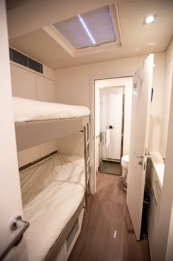 Sicilian Breeze Yacht Photos Pics Interior of 2021 Lagoon Seventy 7 yacht with bunk beds and modern bathroom.