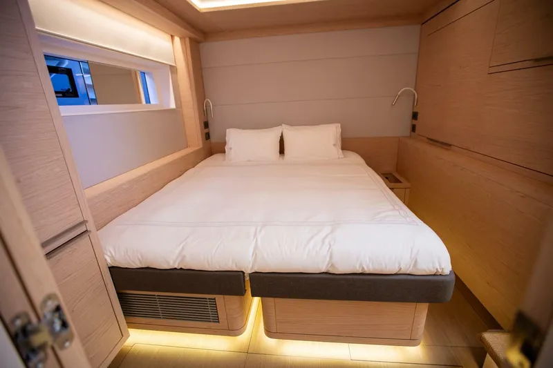Sicilian Breeze Yacht Photos Pics Luxurious bedroom interior of 2021 Lagoon Seventy 7 yacht with modern design.