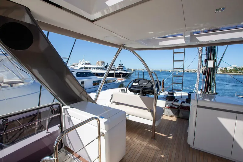 Sicilian Breeze Yacht Photos Pics Luxurious 2021 Lagoon Seventy 7 yacht deck with modern seating and ocean view.
