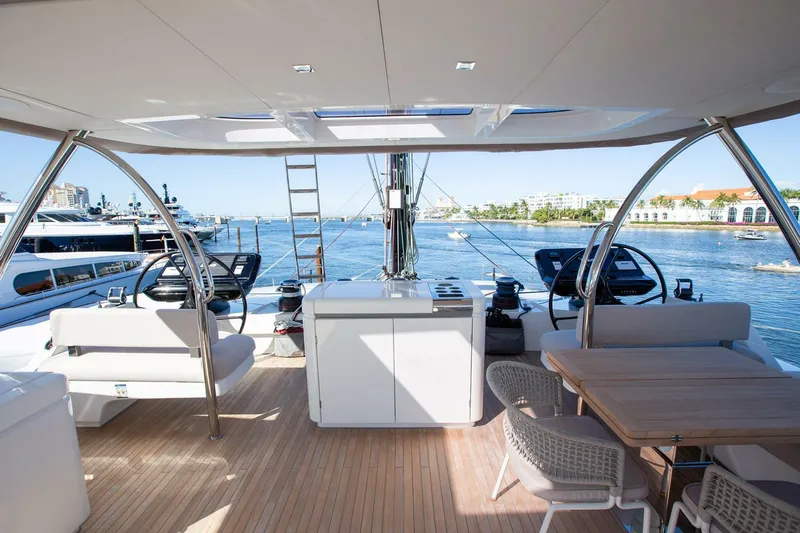 Sicilian Breeze Yacht Photos Pics Luxurious 2021 Lagoon Seventy 7 yacht deck with seating and ocean view.