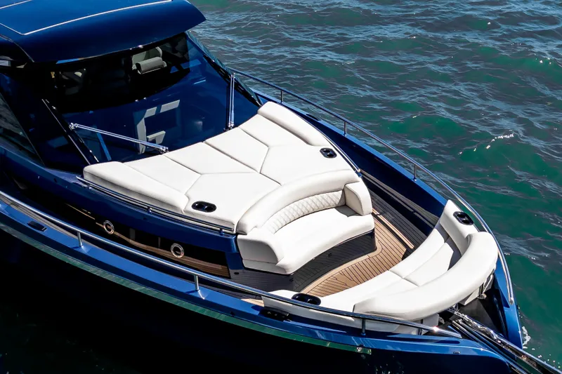  Yacht Photos Pics Luxurious 2025 Dutch American DA 53 yacht with elegant white seating on blue waters.