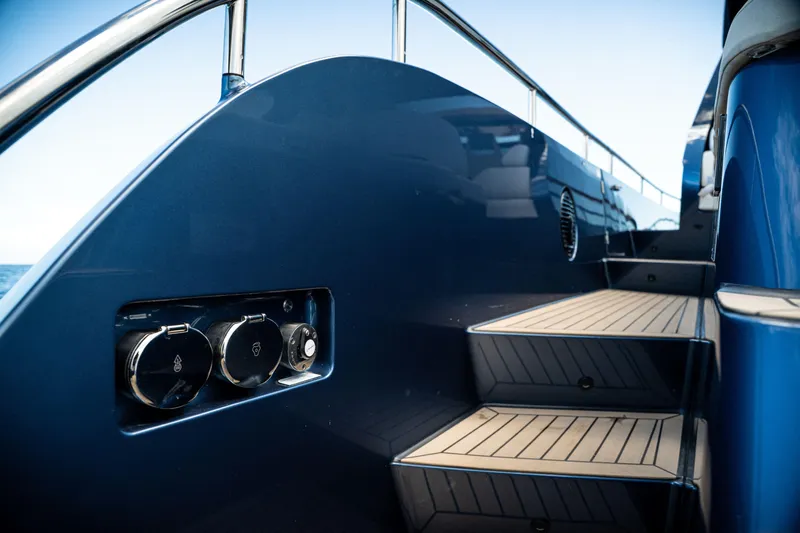  Yacht Photos Pics Luxury yacht Dutch American DA 53, 2025 model, featuring sleek blue exterior and elegant wooden steps.