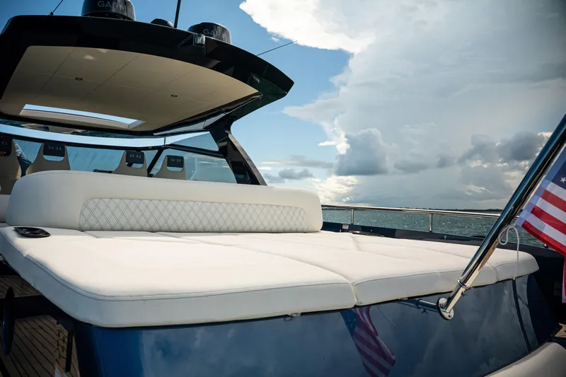  Yacht Photos Pics Luxurious 2025 Dutch American DA 53 yacht with elegant seating and American flag.