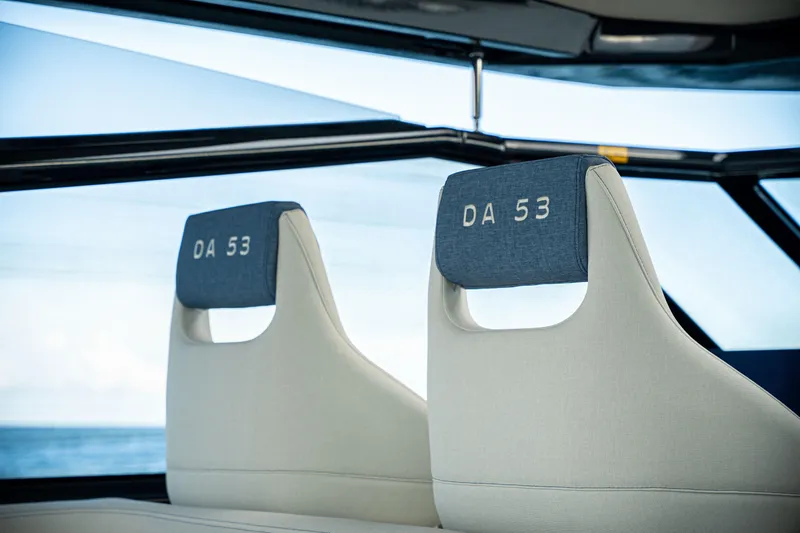 Yacht Photos Pics Luxury seating in 2025 Dutch American DA 53 boat, featuring sleek design and ocean view.