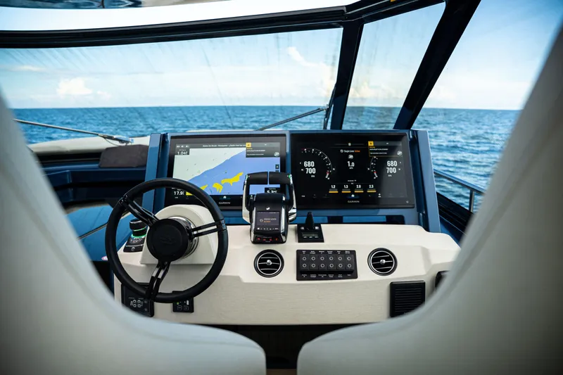  Yacht Photos Pics Cockpit of 2025 Dutch American DA 53 yacht with advanced navigation displays and steering wheel.