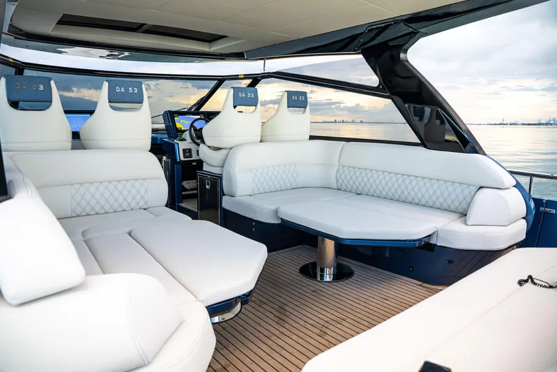  Yacht Photos Pics Luxurious 2025 Dutch American DA 53 yacht interior with elegant white seating and modern design.