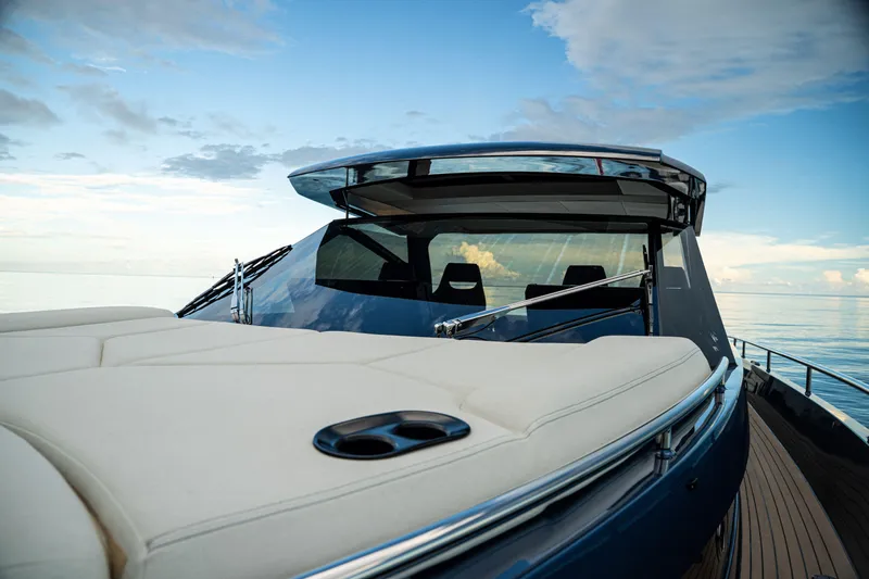  Yacht Photos Pics Luxurious 2025 Dutch American DA 53 yacht on calm sea under blue sky.