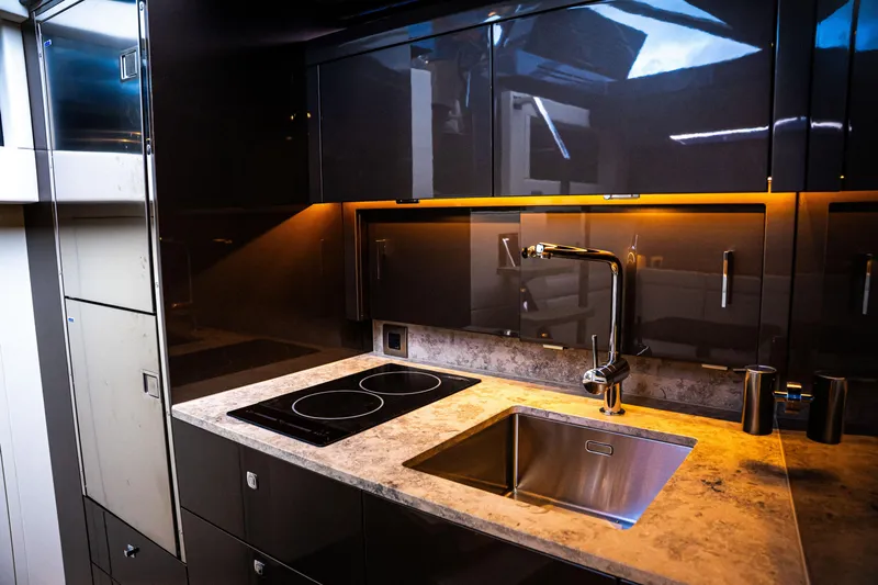  Yacht Photos Pics Modern kitchen interior in Dutch American DA 53, 2025 model, featuring sleek design and appliances.