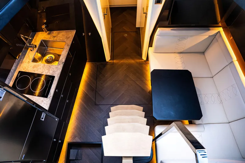  Yacht Photos Pics Luxurious interior of 2025 Dutch American DA 53 yacht with modern kitchen and seating area.