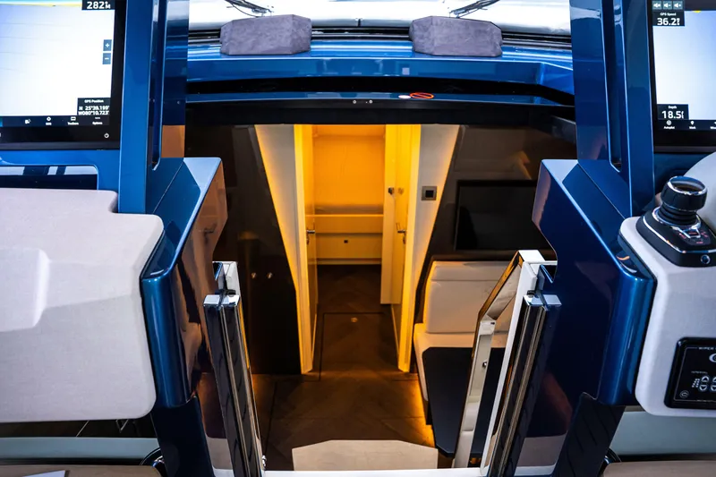 Yacht Photos Pics Interior view of 2025 Dutch American DA 53 yacht, featuring modern navigation controls and luxurious cabin.