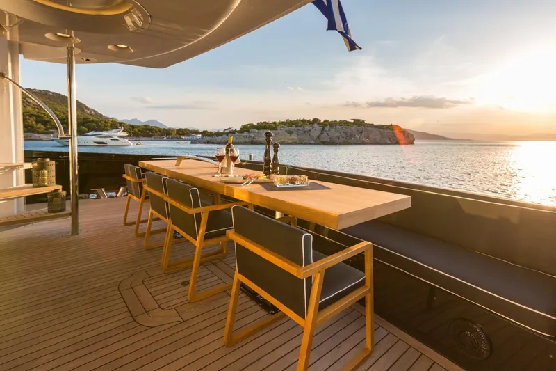 Aquarella Yacht Photos Pics Luxurious Devonport  yacht deck with dining area, ocean view, and sunset ambiance, built in 1994.