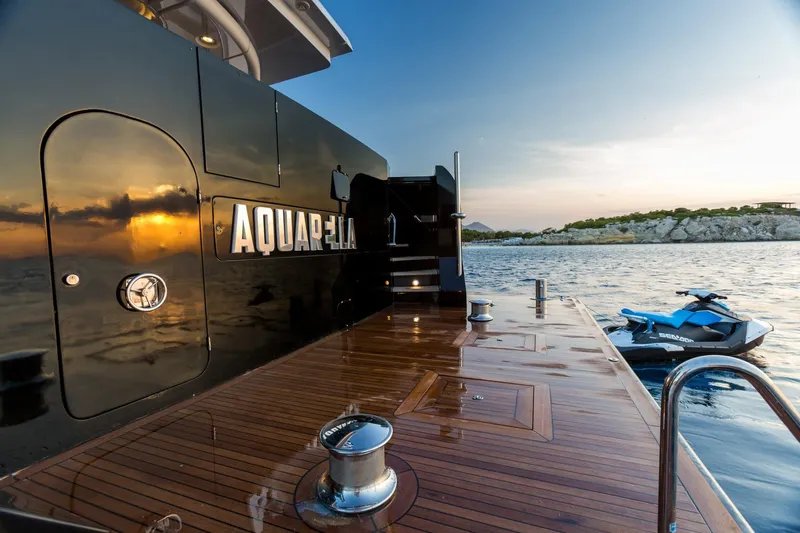 Aquarella Yacht Photos Pics Luxurious Devonport yacht deck with sunset reflection, featuring a jet ski, built in 1994.