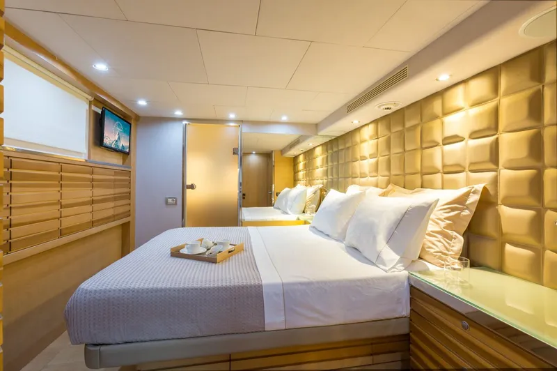 Aquarella Yacht Photos Pics Luxurious bedroom interior on Devonport yacht, featuring elegant lighting and modern decor.
