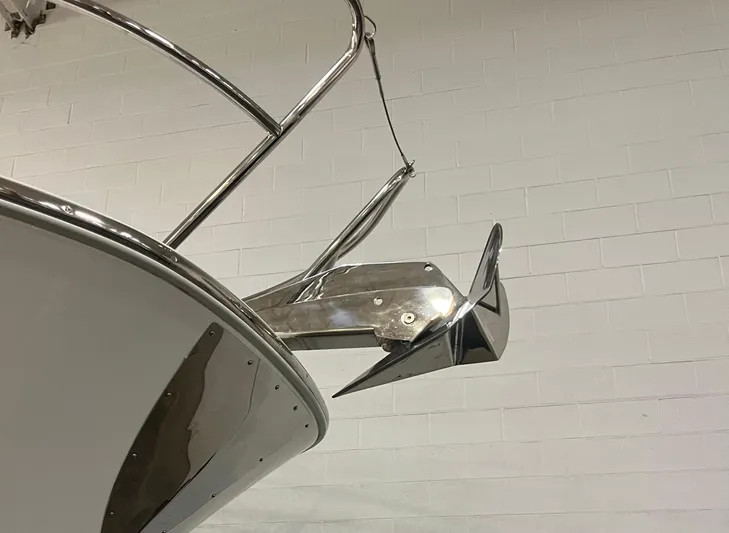  Yacht Photos Pics Bow and anchor of 2021 Jeanneau Leader 12.5 WA boat against a brick wall.