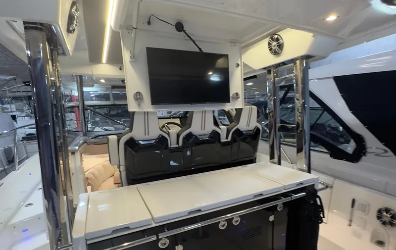  Yacht Photos Pics 2021 Jeanneau Leader 12.5 WA boat interior with seating, TV, and modern amenities.