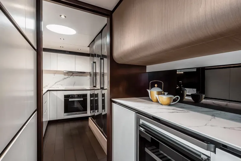 D&y Yacht Photos Pics Luxurious kitchen interior of 2023 Azimut Grande 27 METRI yacht with modern appliances.