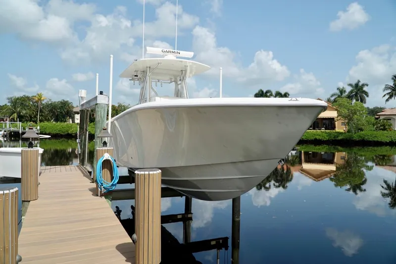 Yacht Photos Pics 2017 SeaVee 34Z boat docked on a calm, reflective waterway.