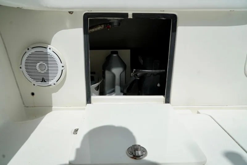 Yacht Photos Pics 2017 SeaVee 34Z boat storage compartment with speaker and equipment.
