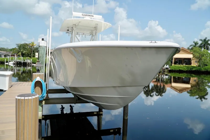  Yacht Photos Pics 2017 SeaVee 34Z boat docked on a calm, reflective waterway.