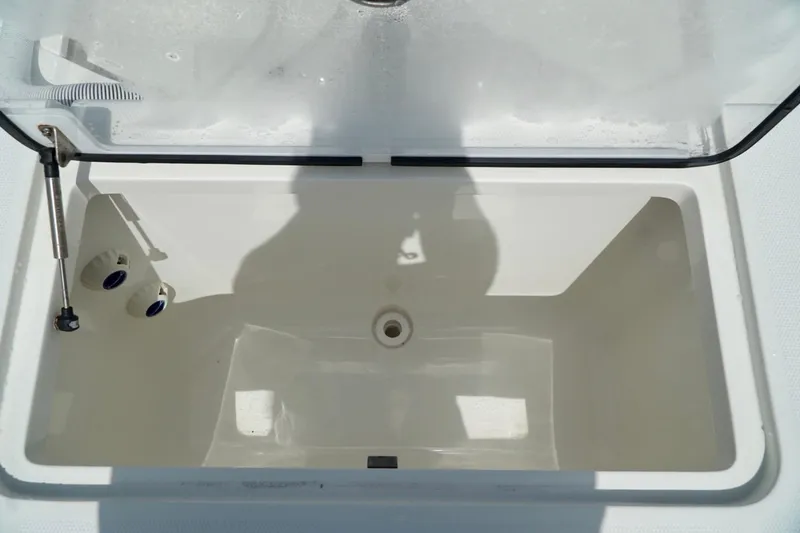  Yacht Photos Pics Open storage compartment on 2017 SeaVee 34Z boat, featuring a clean, white interior.