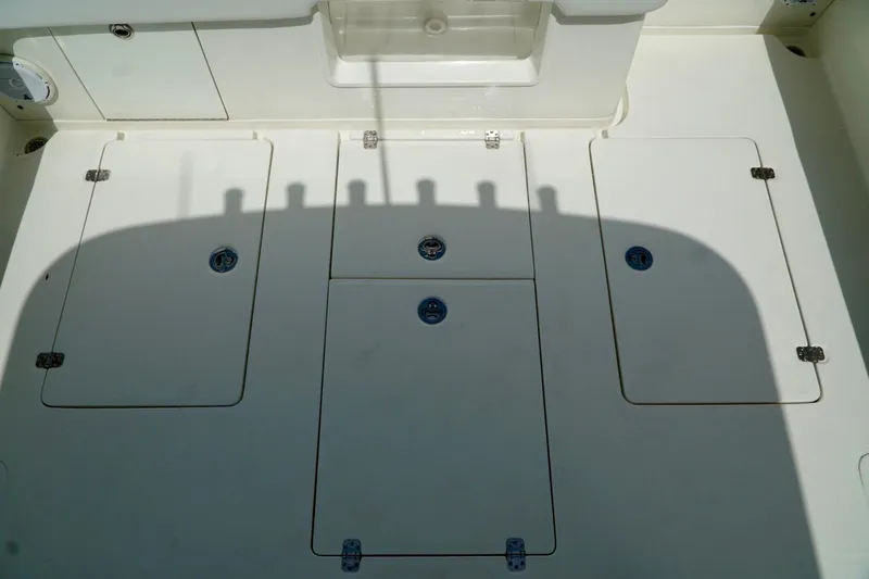  Yacht Photos Pics 2017 SeaVee 34Z boat deck with storage compartments and clean white surface.