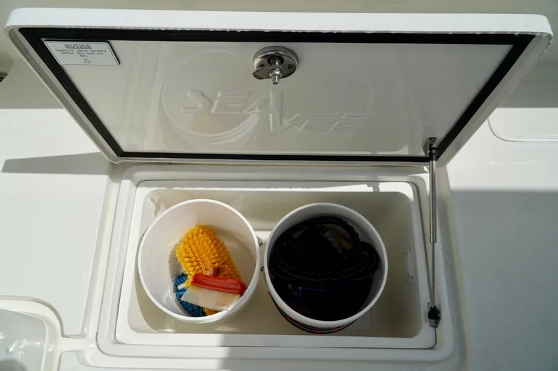  Yacht Photos Pics 2017 SeaVee 34Z storage compartment with cleaning supplies and rope.
