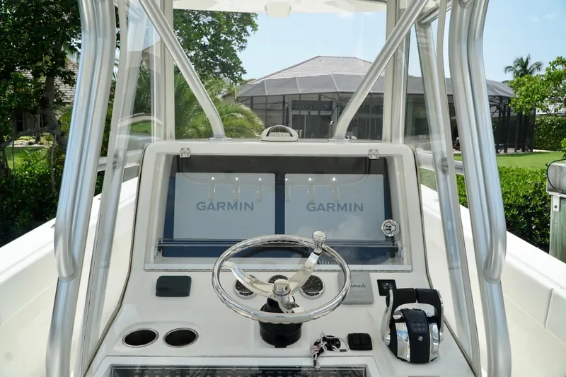  Yacht Photos Pics 2017 SeaVee 34Z boat dashboard with Garmin navigation system and steering wheel.