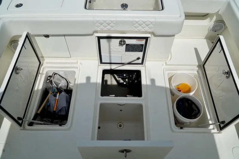 Yacht Photos Pics 2017 SeaVee 34Z boat storage compartments with fishing gear and buckets.