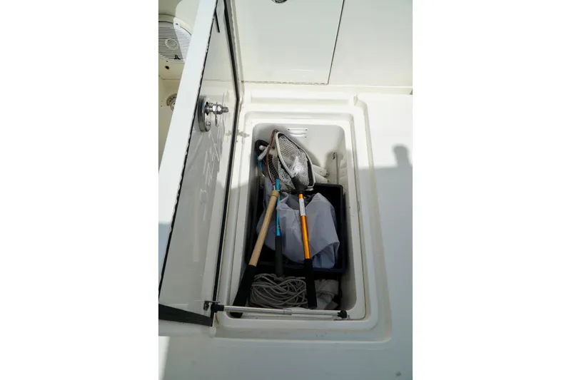  Yacht Photos Pics Storage compartment on 2017 SeaVee 34Z boat with fishing gear and equipment.