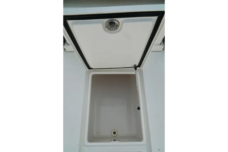  Yacht Photos Pics Open storage compartment on a 2017 SeaVee 34Z boat, featuring a hydraulic lift.
