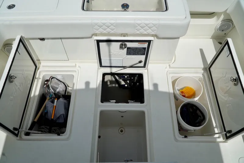  Yacht Photos Pics 2017 SeaVee 34Z boat storage compartments with fishing gear and buckets.