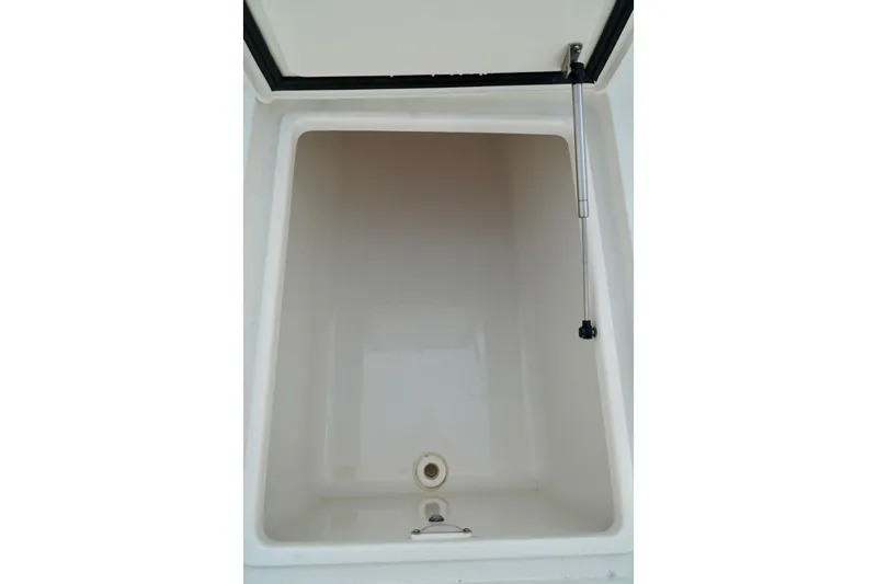  Yacht Photos Pics Storage compartment of 2017 SeaVee 34Z boat, featuring a hydraulic lift.