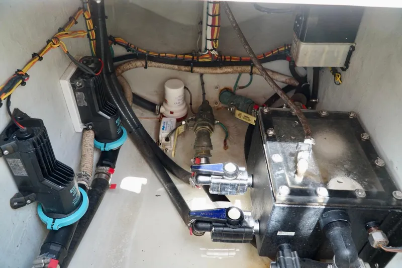  Yacht Photos Pics Engine compartment of a 2017 SeaVee 34Z boat, showcasing wiring and mechanical components.
