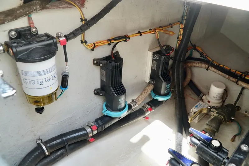  Yacht Photos Pics 2017 SeaVee 34Z boat engine compartment with pumps, filters, and wiring.