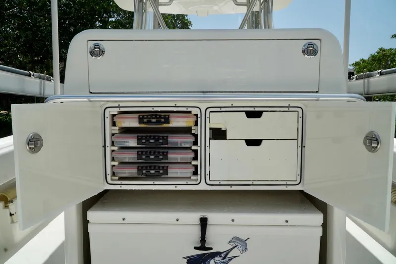  Yacht Photos Pics 2017 SeaVee 34Z boat storage compartments with tackle boxes and drawers open.