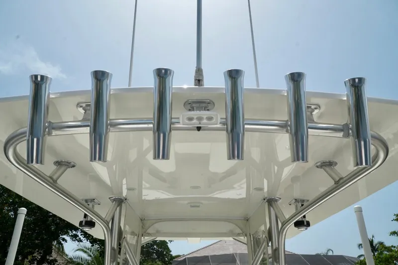  Yacht Photos Pics 2017 SeaVee 34Z boat with stainless steel rod holders under a clear blue sky.