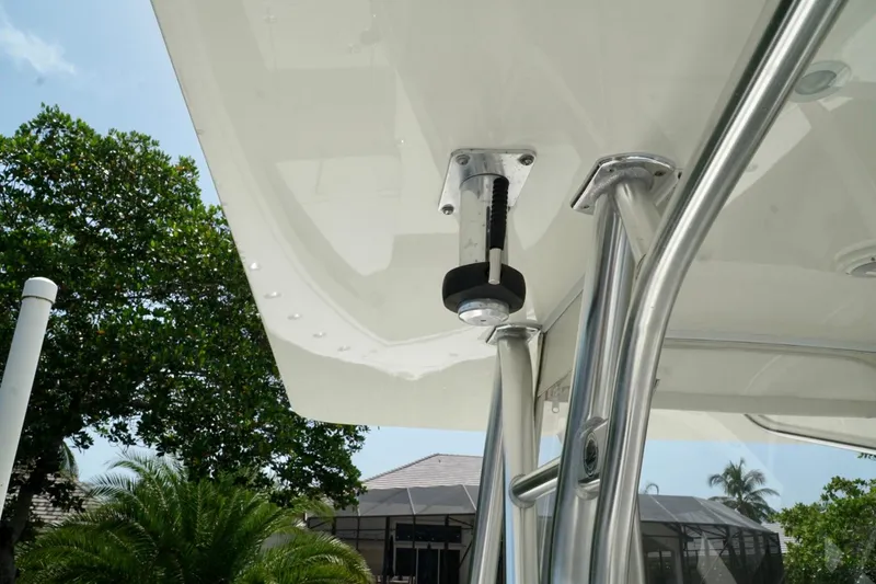  Yacht Photos Pics 2017 SeaVee 34Z boat with stainless steel T-top structure and clear sky background.