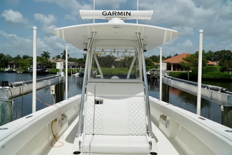  Yacht Photos Pics 2017 SeaVee 34Z boat with Garmin equipment, docked in a scenic waterfront setting.