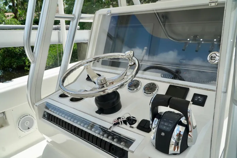  Yacht Photos Pics 2017 SeaVee 34Z boat helm with steering wheel and control panel.
