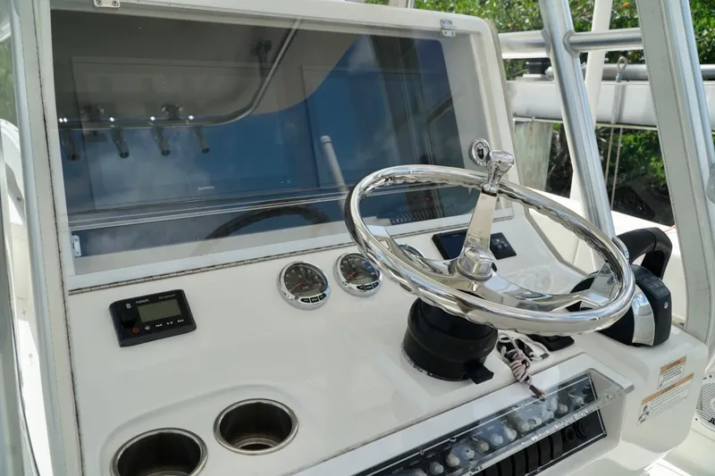 Yacht Photos Pics 2017 SeaVee 34Z boat helm with steering wheel and control panel.