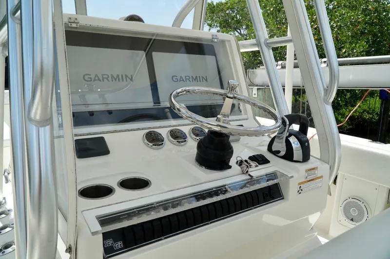  Yacht Photos Pics 2017 SeaVee 34Z boat helm with dual Garmin displays and stainless steel steering wheel.