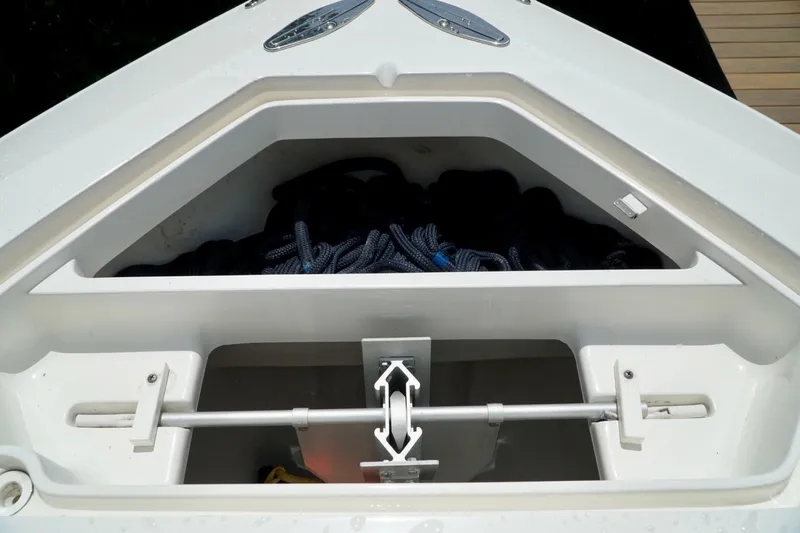  Yacht Photos Pics Anchor storage compartment on 2017 SeaVee 34Z boat, featuring ropes and anchor mechanism.