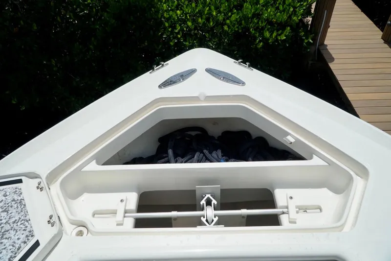  Yacht Photos Pics 2017 SeaVee 34Z boat anchor storage compartment with ropes, dockside view.