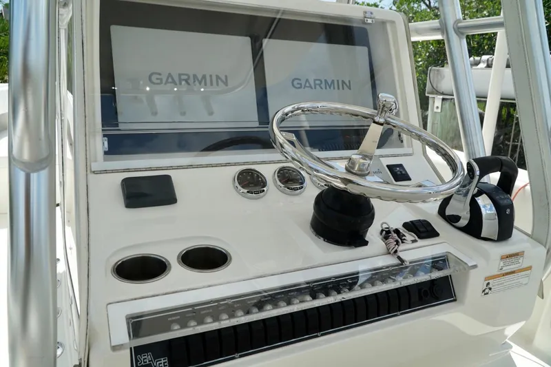  Yacht Photos Pics 2017 SeaVee 34Z boat helm with Garmin displays and chrome steering wheel.