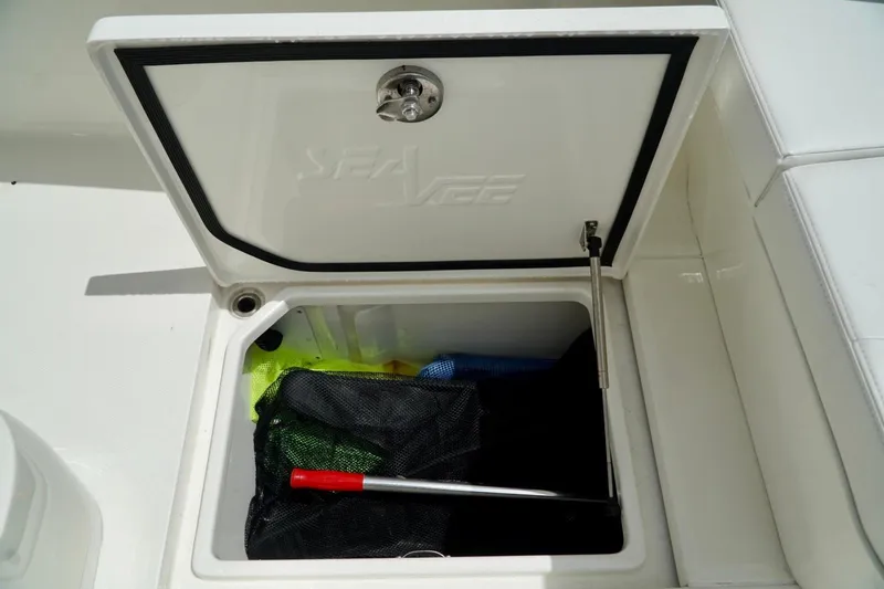  Yacht Photos Pics Open storage compartment on 2017 SeaVee 34Z boat, featuring organized gear and equipment.